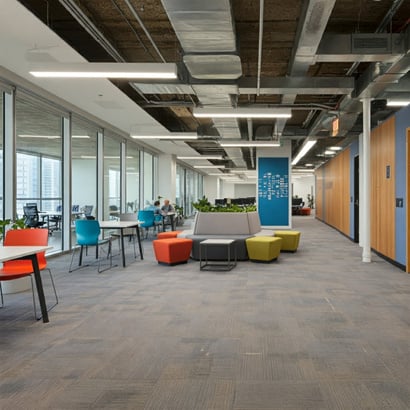 Modern open office space with collaborative seating areas and a bright, spacious design.